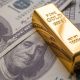 Gold prices fall further from record highs as dollar reigns after SNB cut