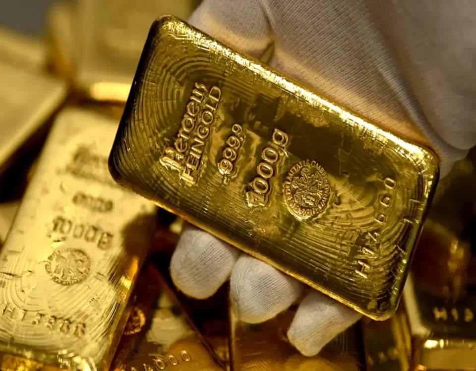 Gold prices fall from record highs; technical signs flash overbought